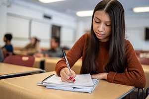 sss student in class taking notes